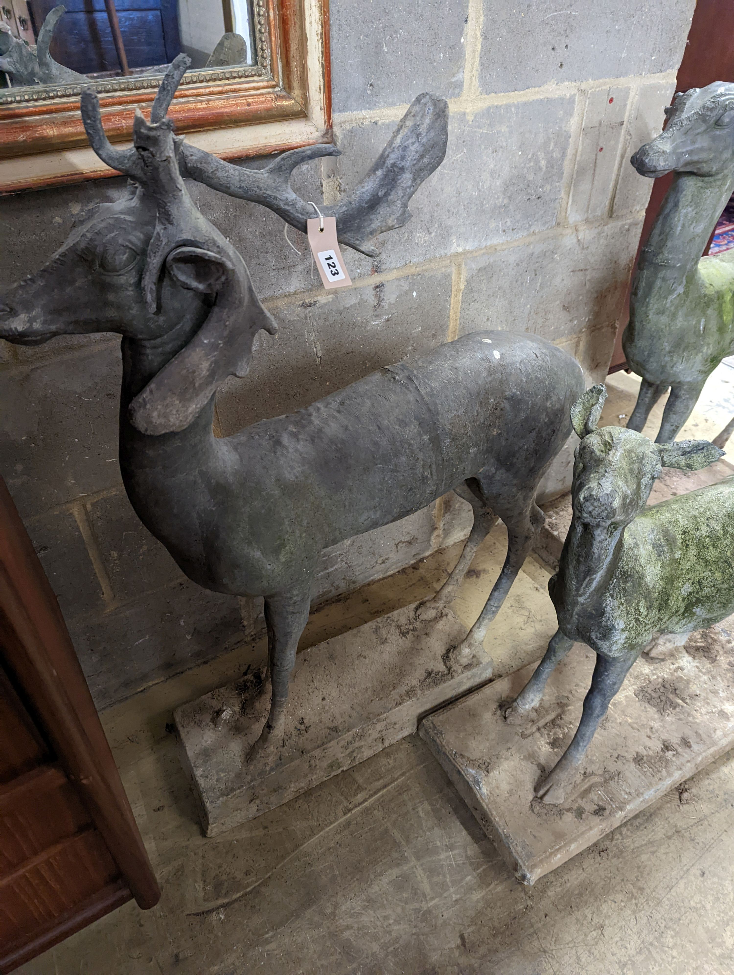 Three lead garden statues modelled as deer, largest height 105cm